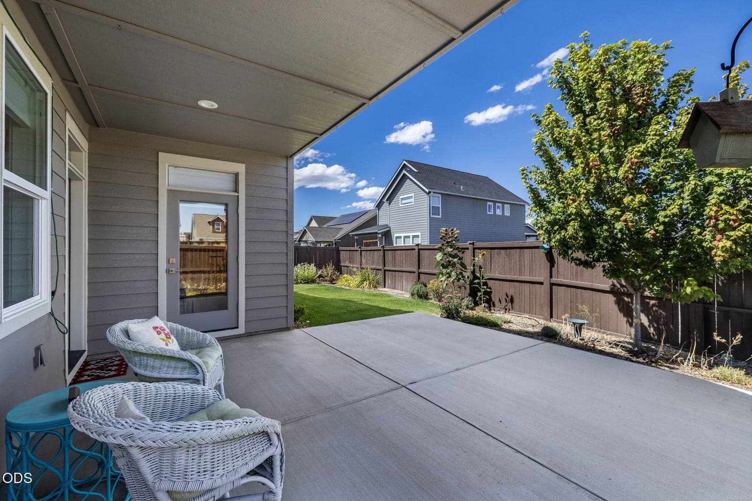 Partially covered back patio with expanded patio