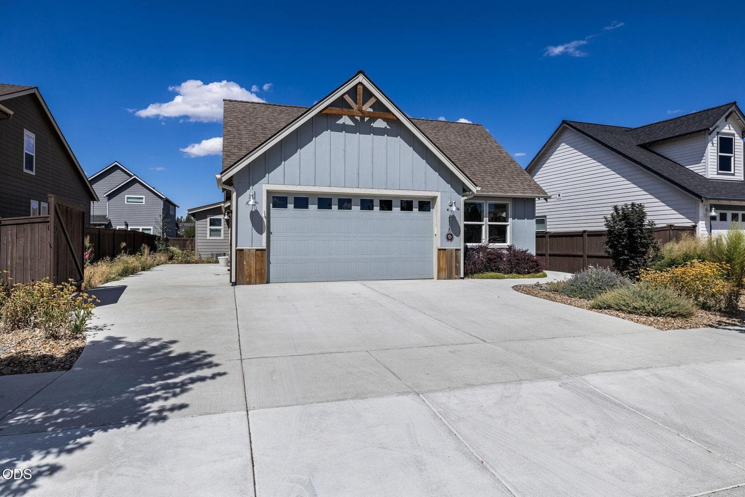 Two car oversized garage with side RV pad on left