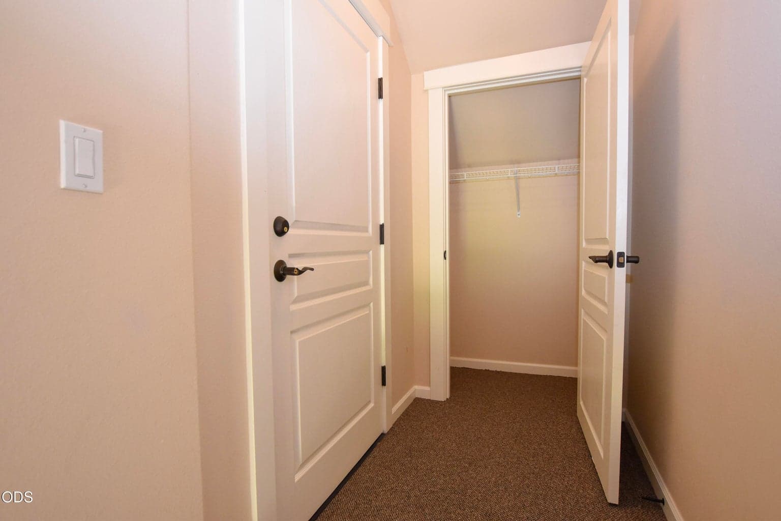 Landing at top of stairs with closet