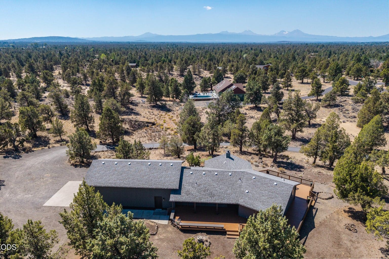 drone view over rooftop with mountain views