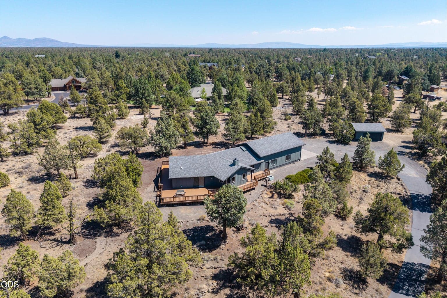 aerial with driveway and detatched garage
