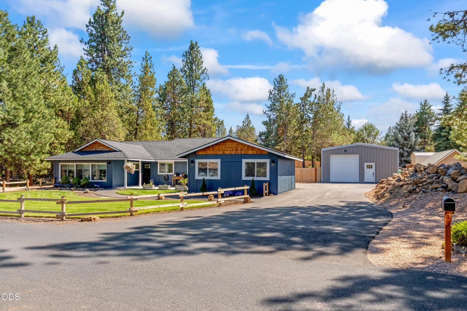 New Asphalt Driveway leading to 26x40 Detached Shop Driveway has pkenty of parking available and Plug available for EV Cars