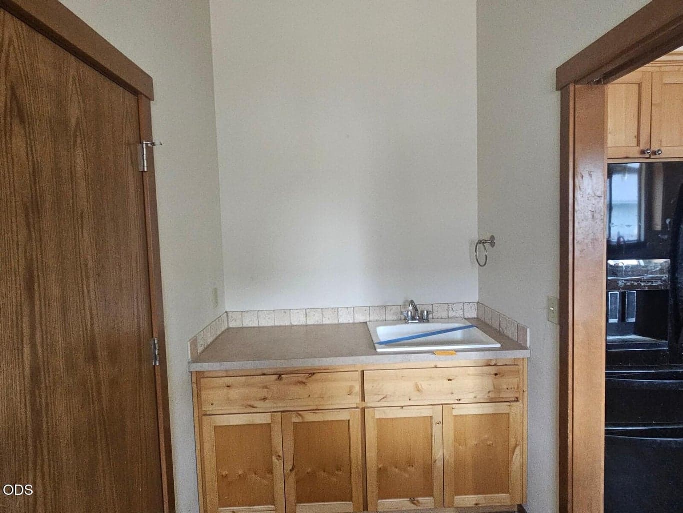With base cabinetry and mud sink