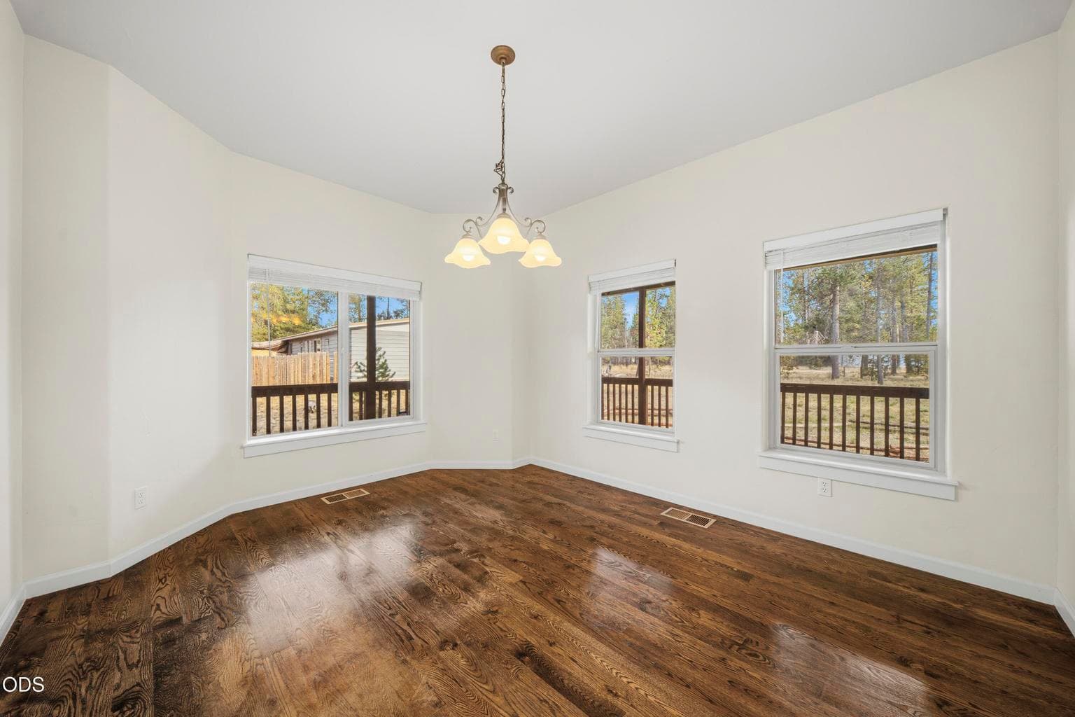 Look at those hardwood floors in the den!