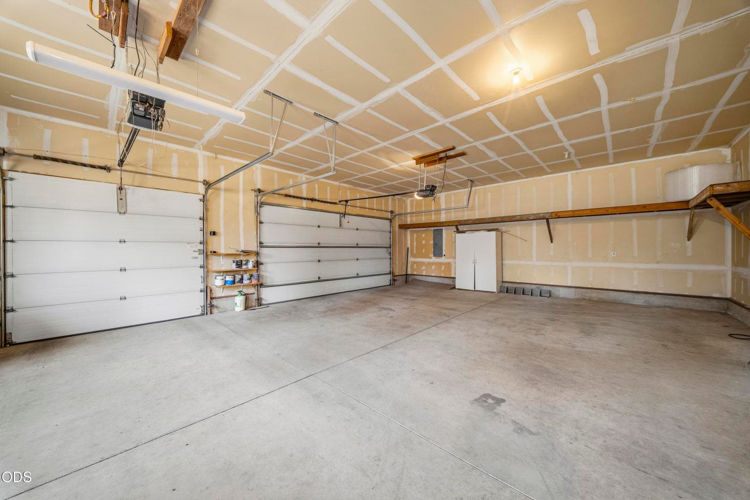 Room for all the toys in this three (3) car garage! The man door goes right out to the back yard/porch