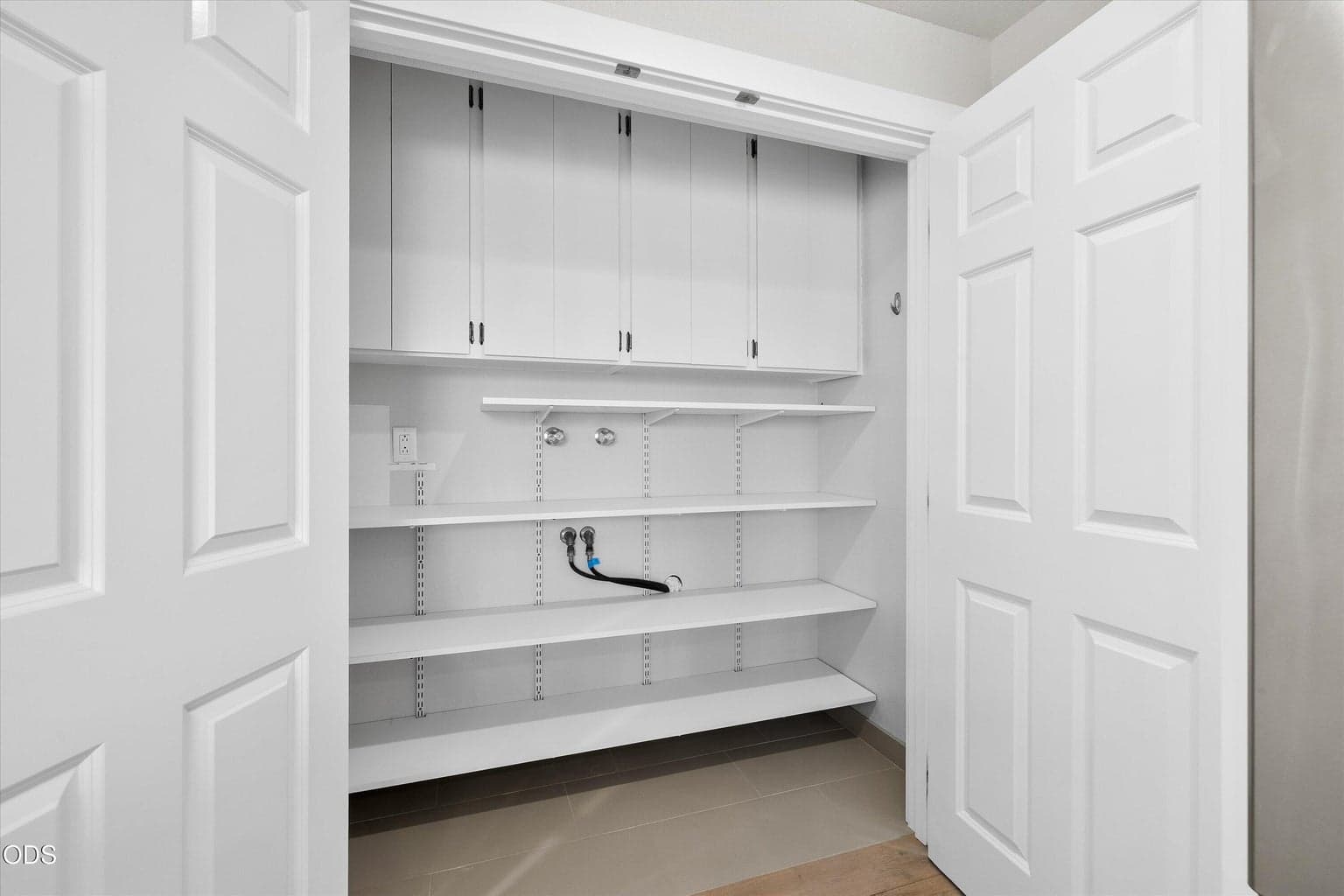 A double door pantry for all of your needs.