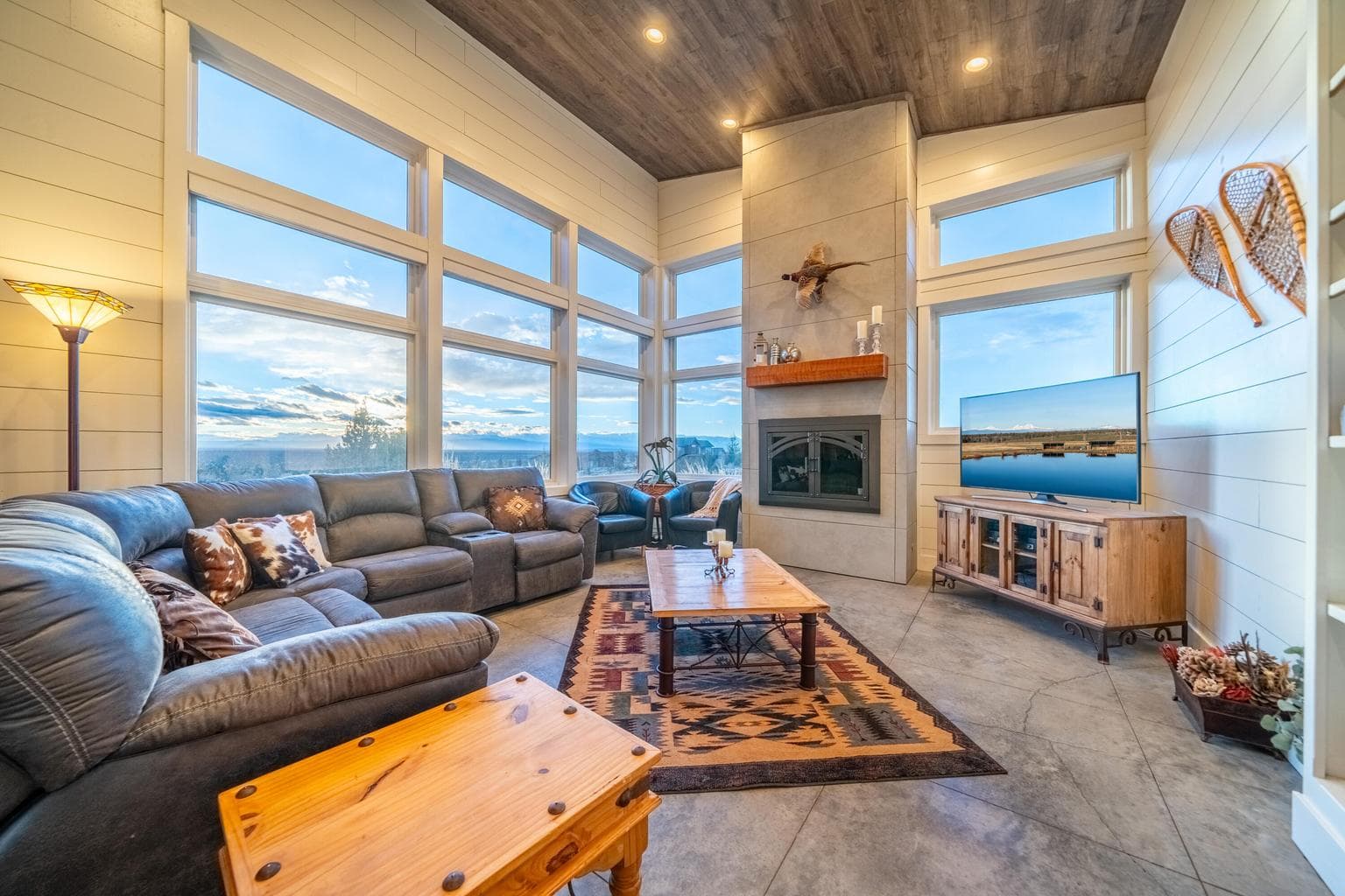 Floor to ceiling wood burning FP w/ gas started and deluxe iron glass doors