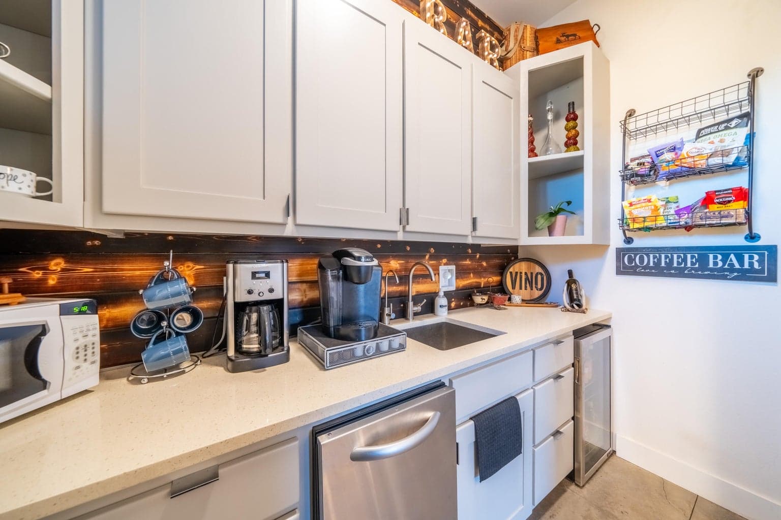 Bright and stylish walk-in Butlers pantry with sink and LOTS of cabinets!