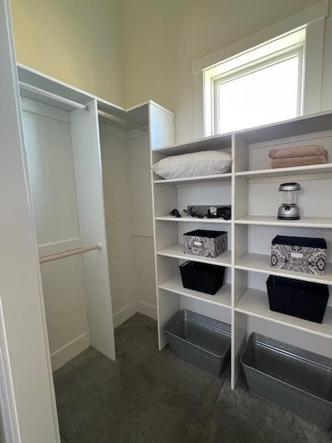 ADU large walk in closet with shelving and plenty of hanging space