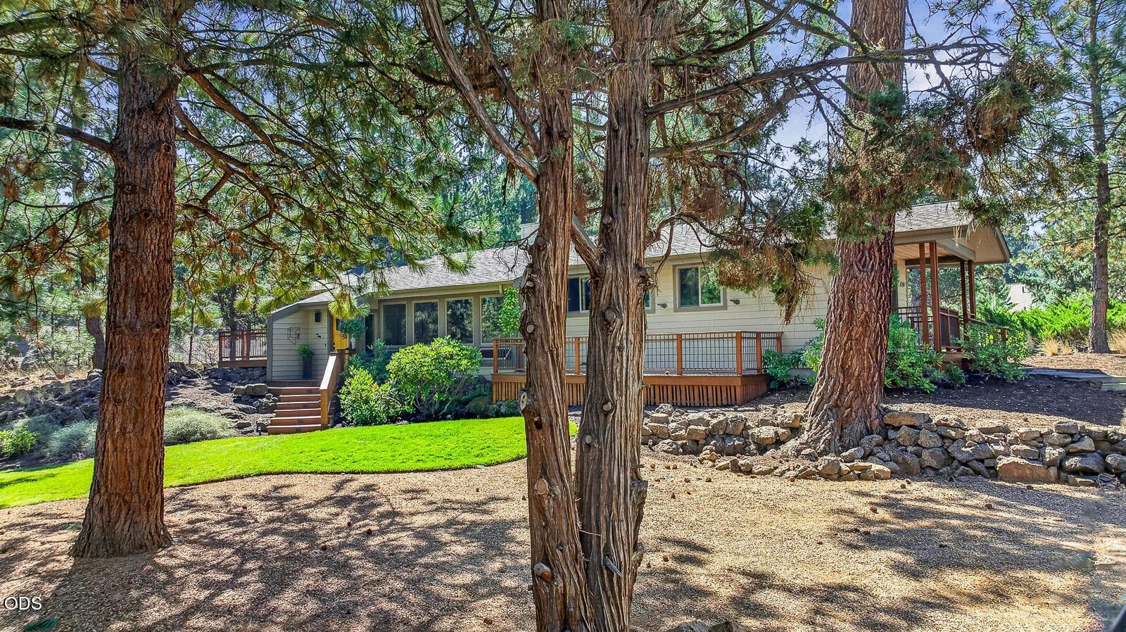 Nestled among the trees on a .55 acre lot