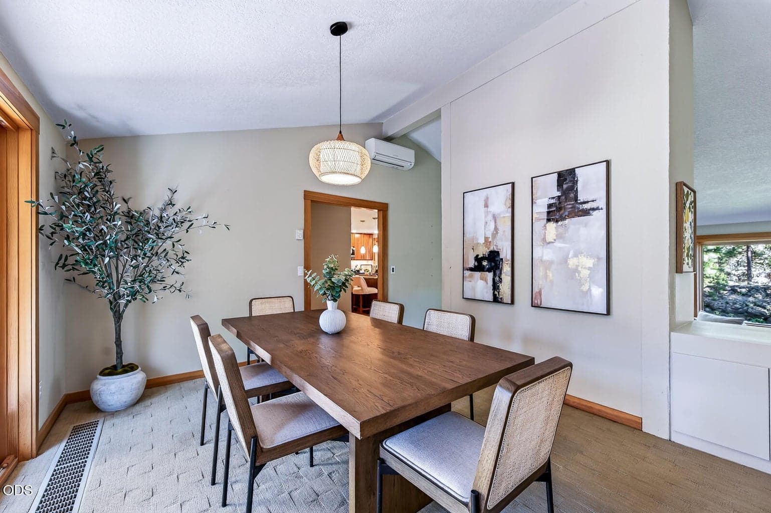 Spacious dining room with plenty of room for more. The kitchen is the through the doorway in the background