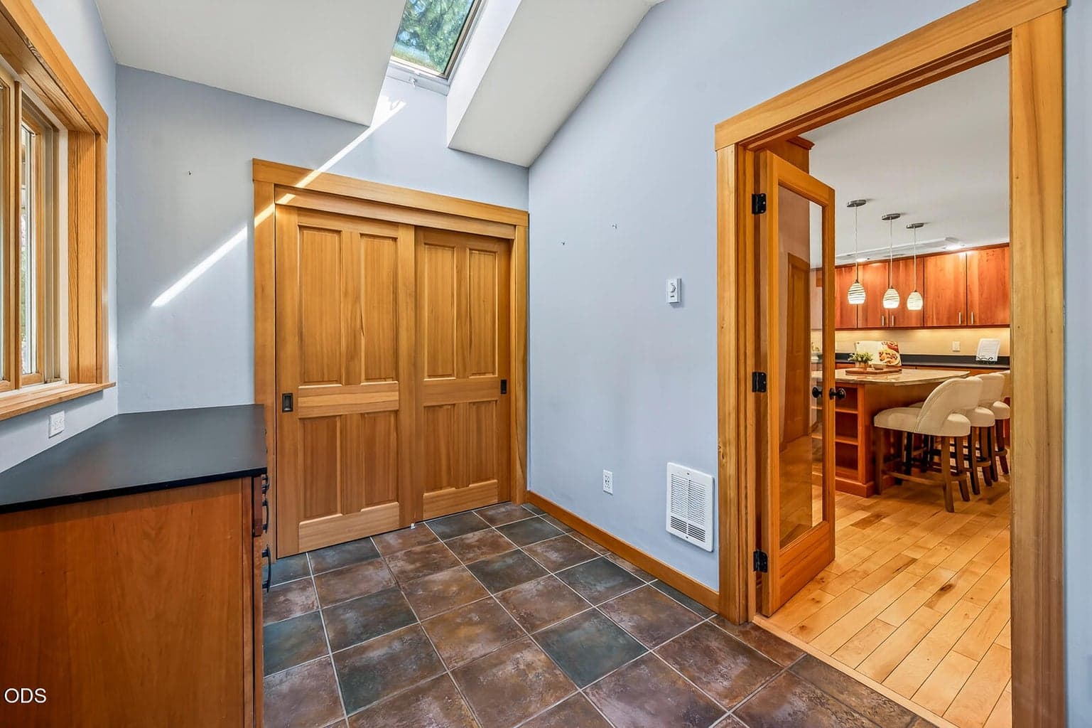 This mudroom is located off of the kitchen and has a entrance from the outside, as well.