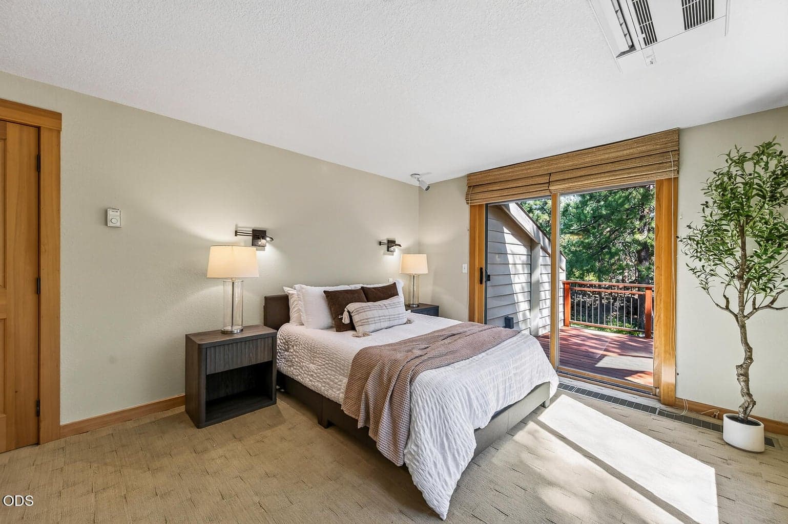 Primary bedroom with a private deck (one of three decks at this home)