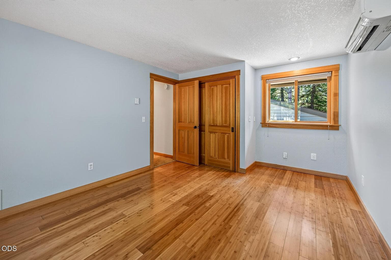 Guest bedroom with bamboo flooring