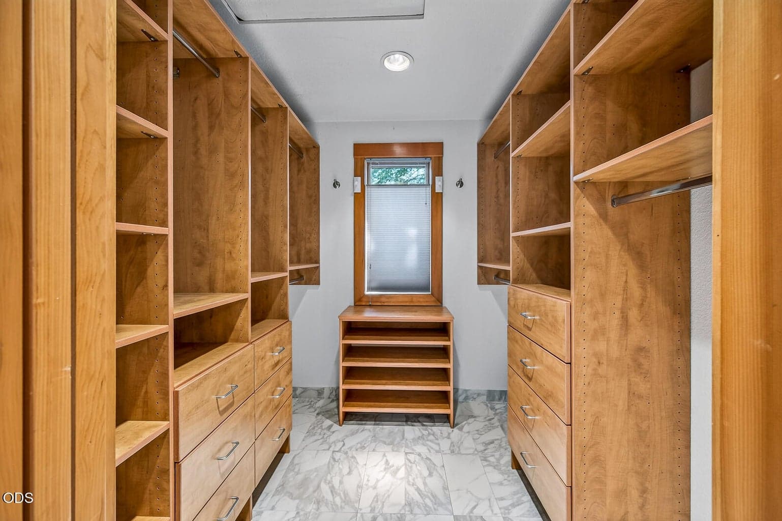 Custom cabinets in the primary closet by Brian's Cabinets (a local favorite)