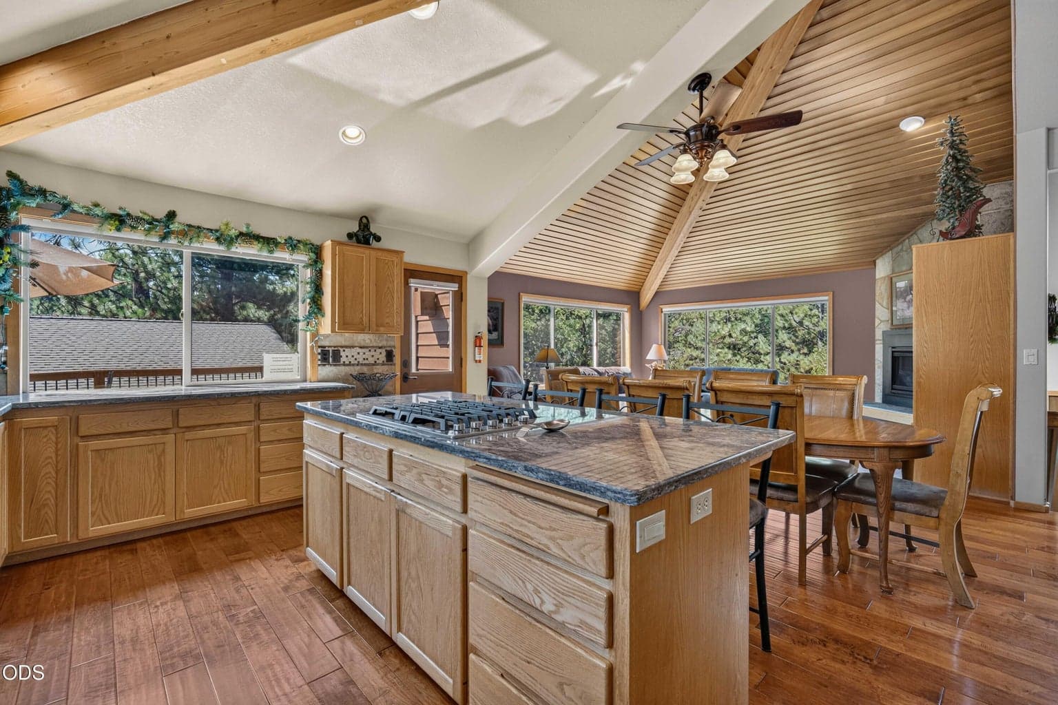 The spacious kitchen island adds prep space, casual seating and a natural hub for gathering.