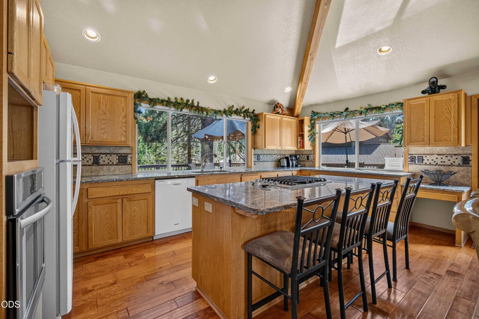 A roomy kitchen with abundant cabinetry and counter space makes cooking for family and guests easy.