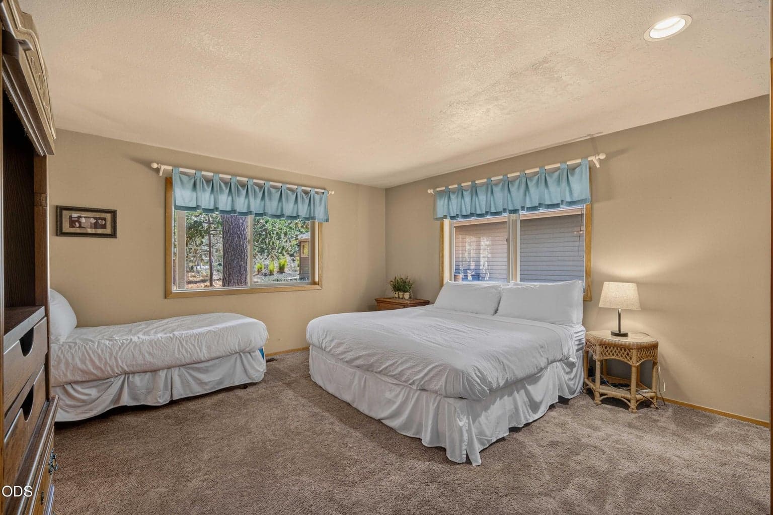 A spacious downstairs suite offers comfortable accommodations for family and guests, with room to settle in and truly feel at home.