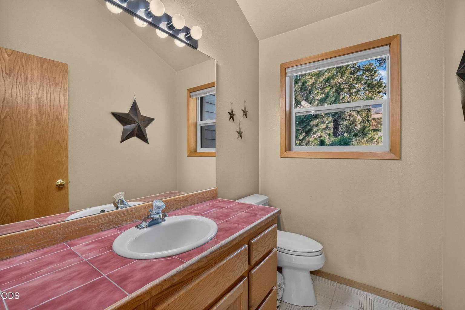 Convenient upstairs half bath located just off the main living areas and near the primary suite.