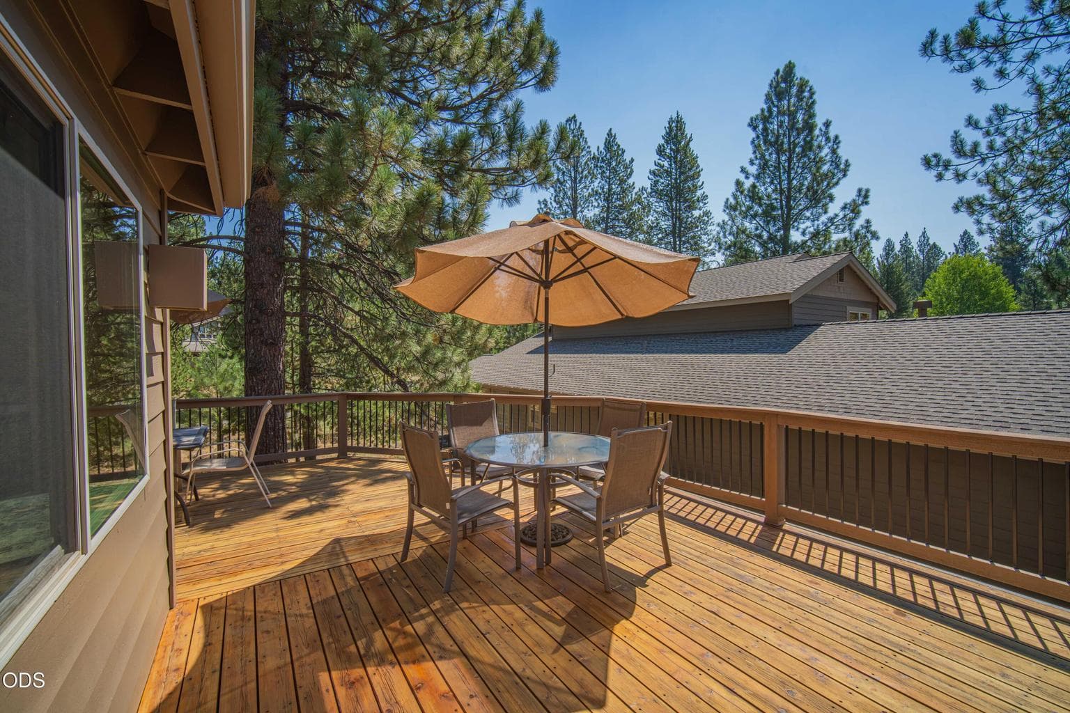 Outdoor dining beneath the pines extends the living space into the Central Oregon sunshine.