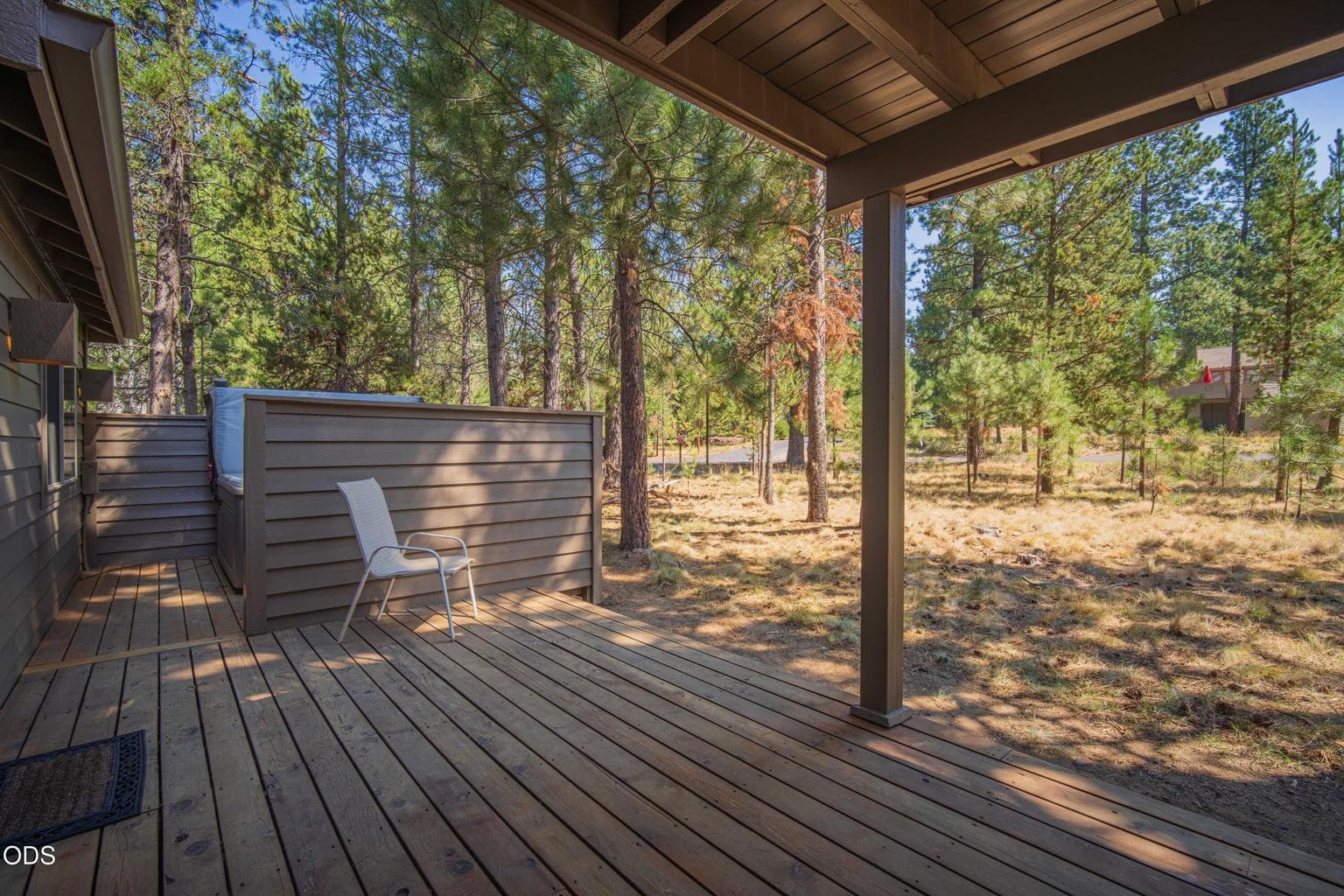 The lower deck provides additional outdoor living space with access from both the downstairs suite bath and the downstairs guest bath, plus an easy connection to the hot tub.