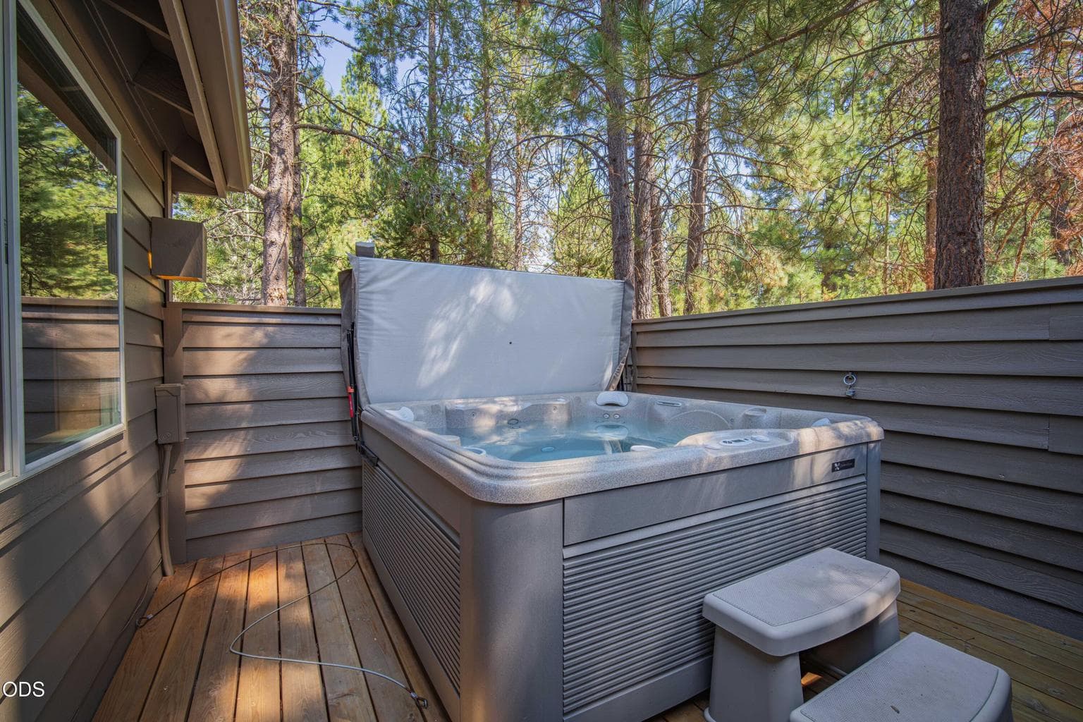 A private hot tub adds an inviting place to unwind after a full day of Sunriver recreation.
