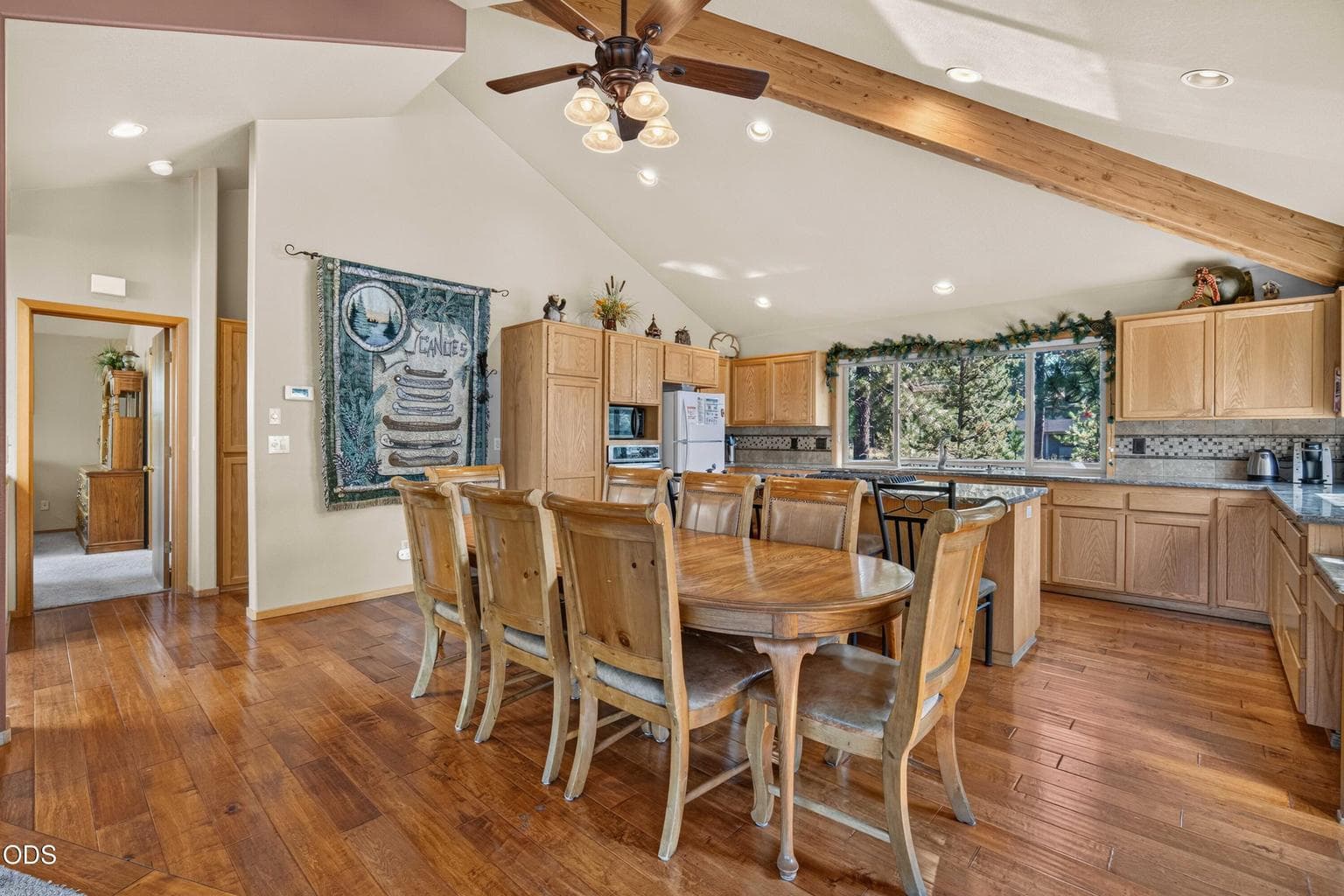 Gather everyone around the generous dining table, with the kitchen close at hand for easy meals, conversation and game nights.
