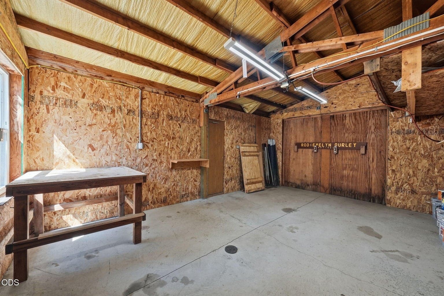 Additional workshop area with door to additional storage area.