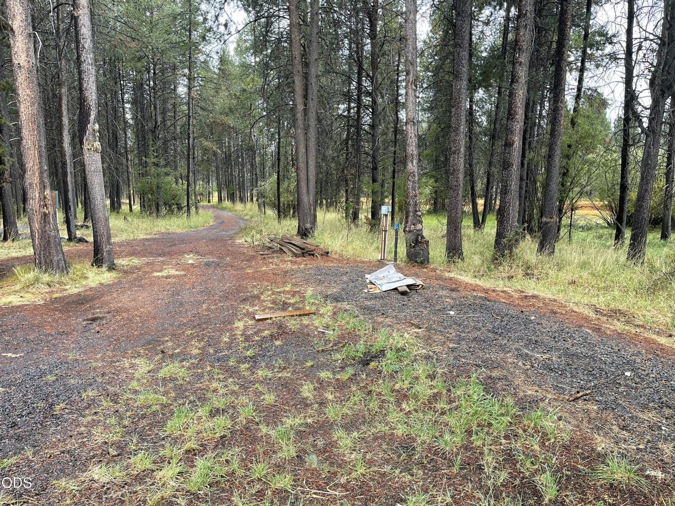 Trailer was parked to the right and looking at driveway.