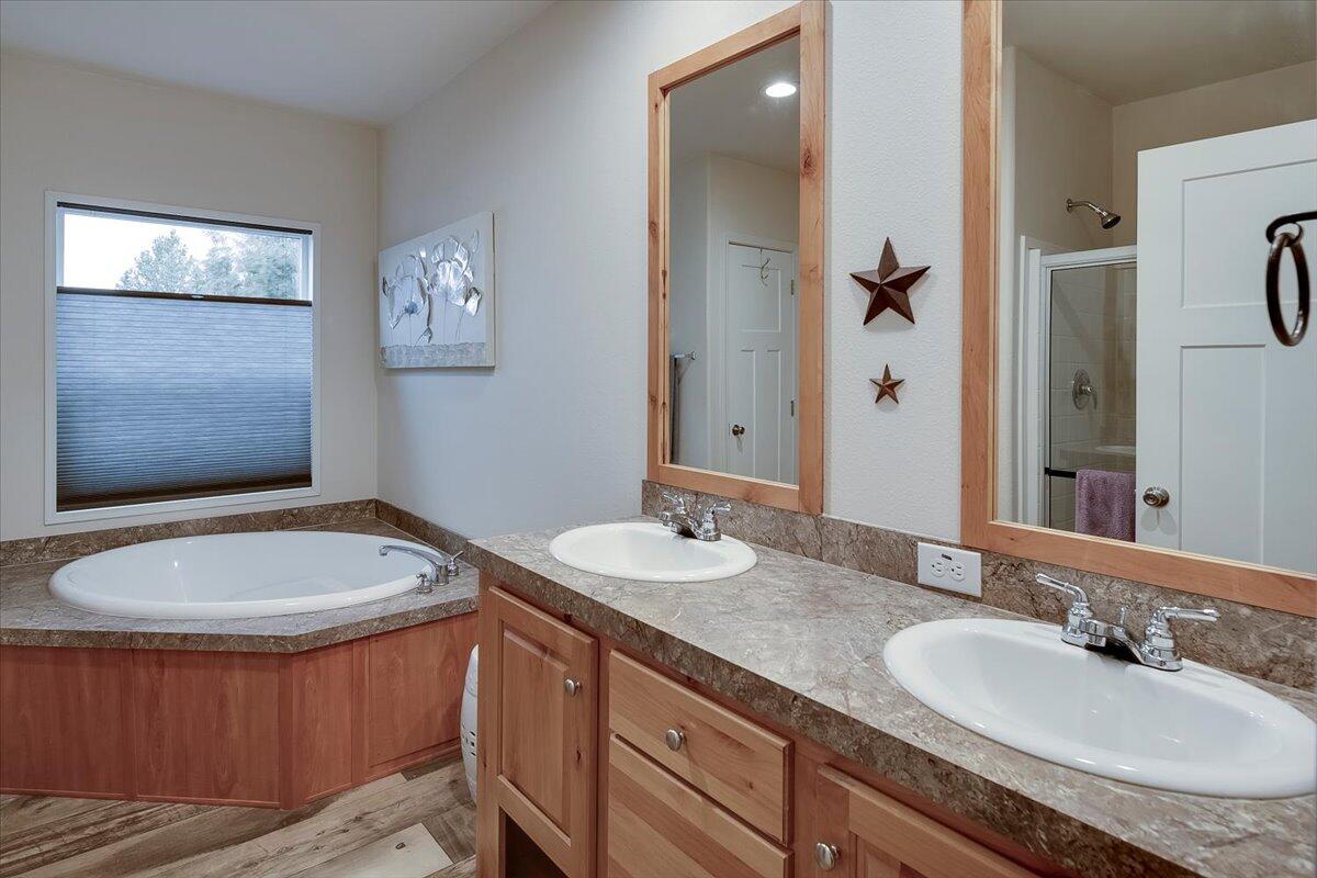 Primary bathroom with soaking tub and dual vanity