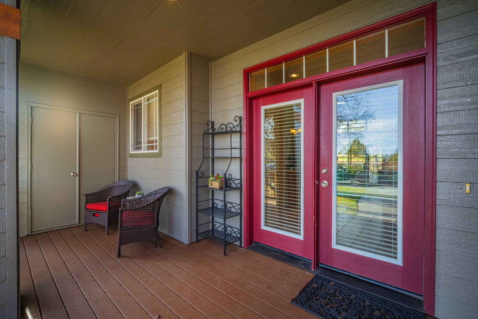 Spacious front porch with two locked storage areas