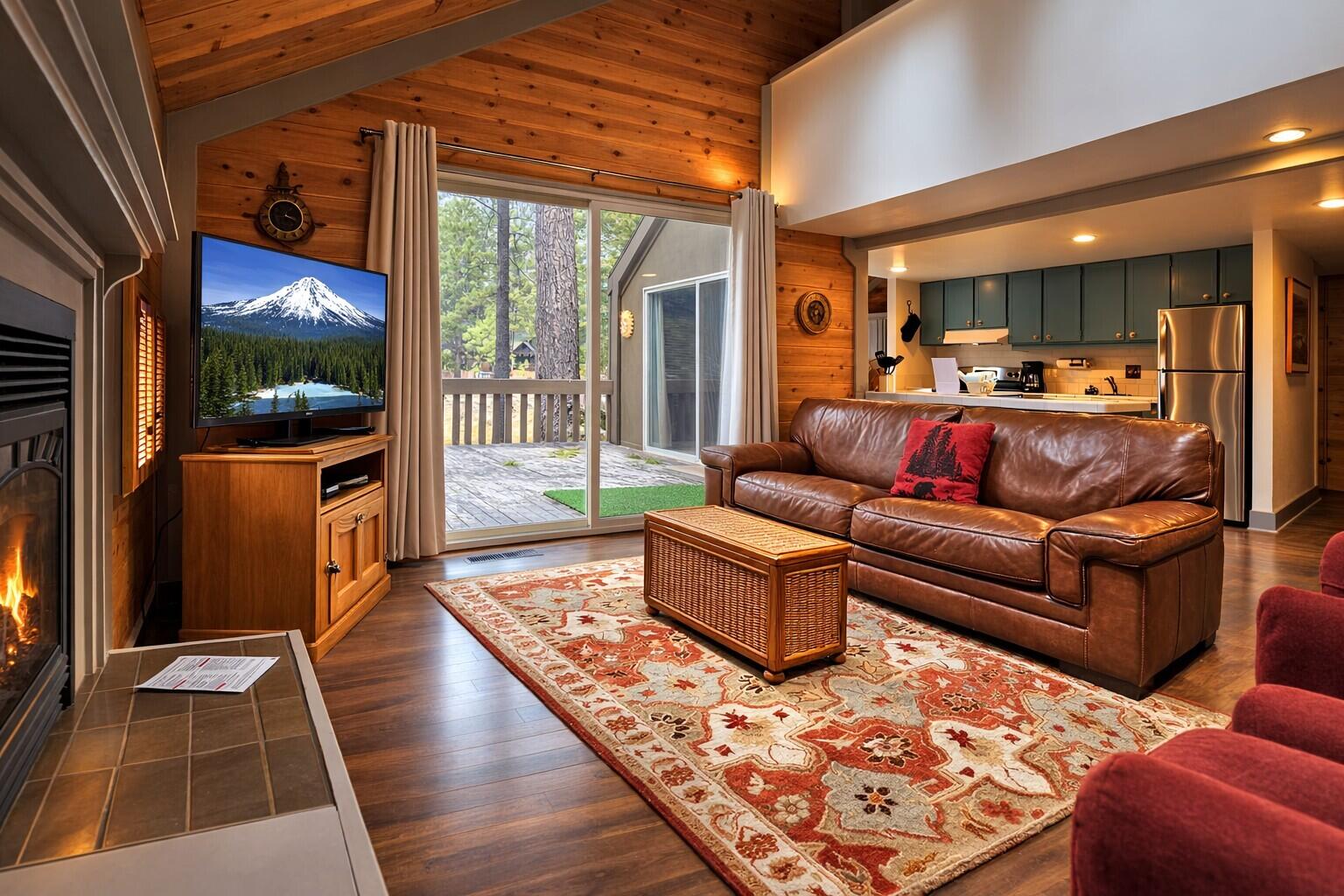 Vaulted ceilings w/ skylights, gas fireplace and warm wood tones create an inviting lodge-style living space