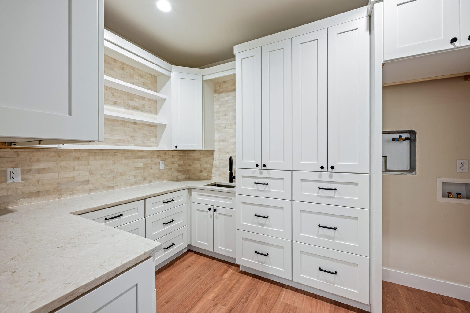 Mud Room with tons of storage, electrical outlets in cabinets
