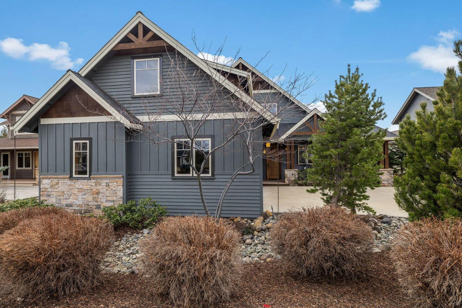 Mature, easy care landscaping in front of the garage in coveted PMV neighborhood.
