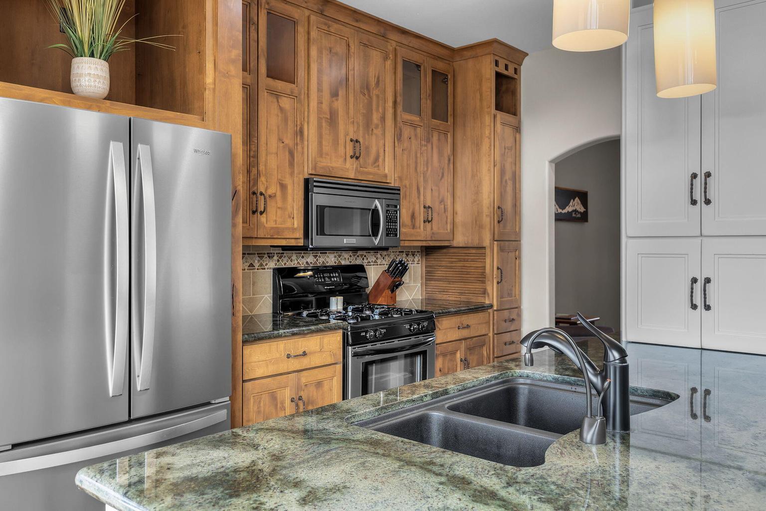 Handcrafted cabinetry and 3 pantries provide exceptional storage and ample room for more than one chef.