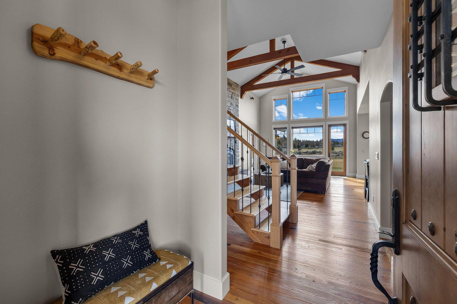 Step inside and stay awhile, where the high-quality door, beautiful flooring, and impressive beams set the tone.