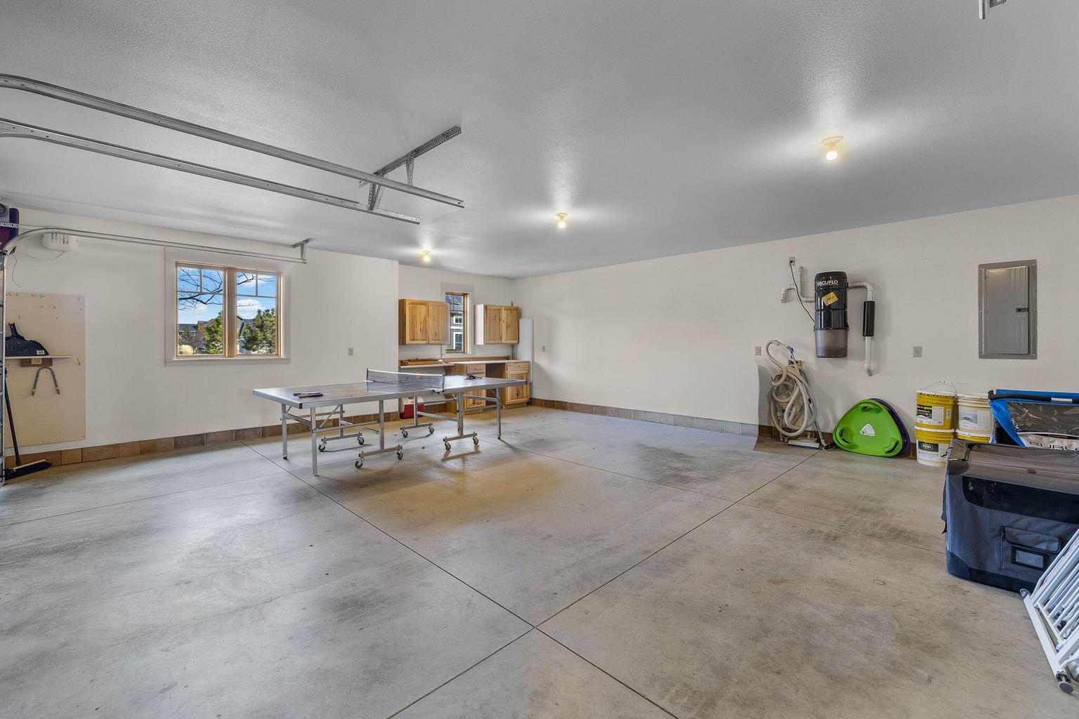 The workbench is tucked away and still plenty of storage space around the whole house vacuum!