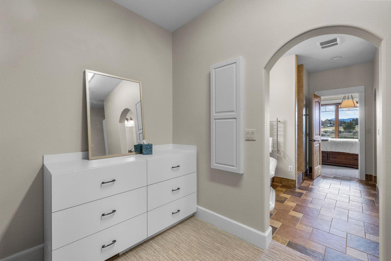 Built-in ironing board can be tucked away.