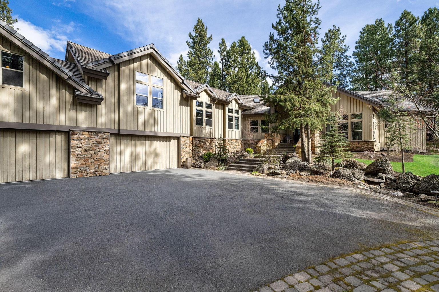 Serene, private, and beautifully refined, this exceptional Broken Top residence offers a rare combination of peaceful woodland setting and elevated golf course views.