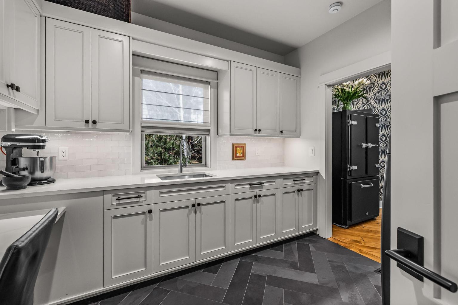 Expansive butler’s pantry with extensive cabinetry, additional prep space, and additional refrigeration—thoughtfully designed for seamless entertaining and everyday function.
