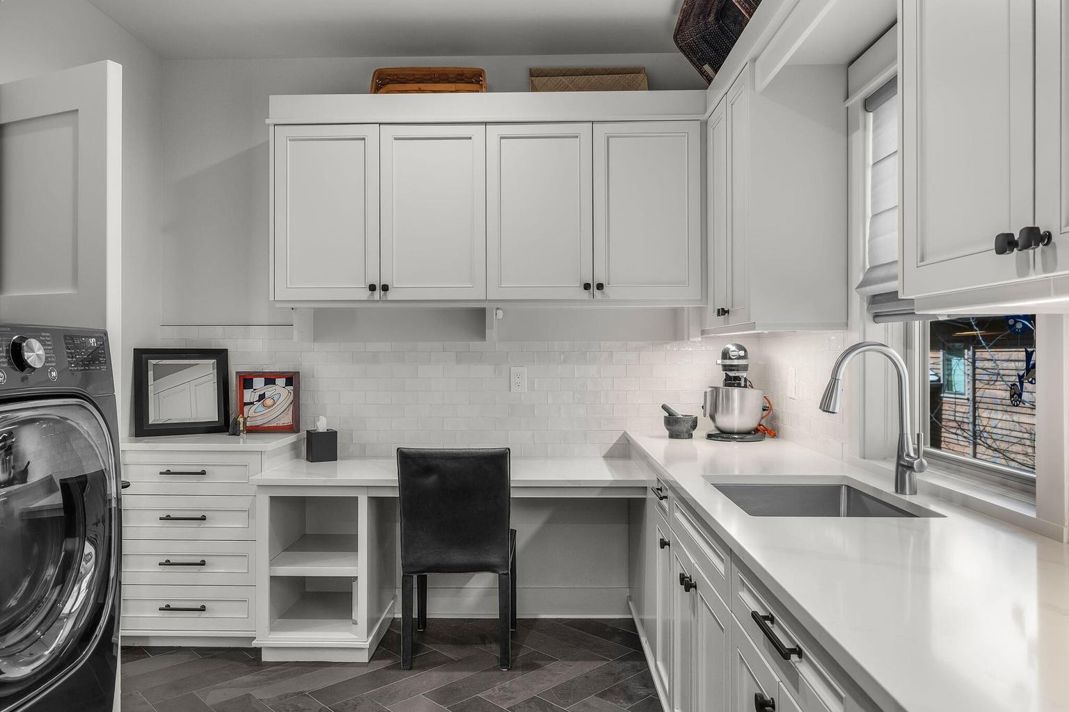 Laundry area includes LG ThinQ Front Load Washer & Dryer, with sweater washing drawer, deep Franke Stainless Steel Sink