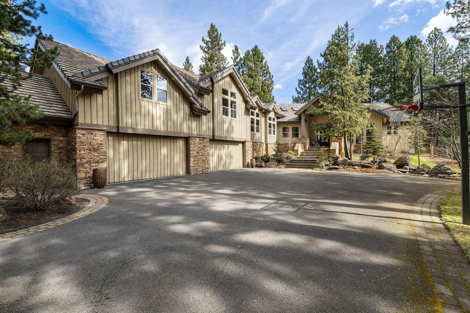 A welcoming departure framed by mature landscaping, reflecting the home’s private setting and lasting sense of arrival.