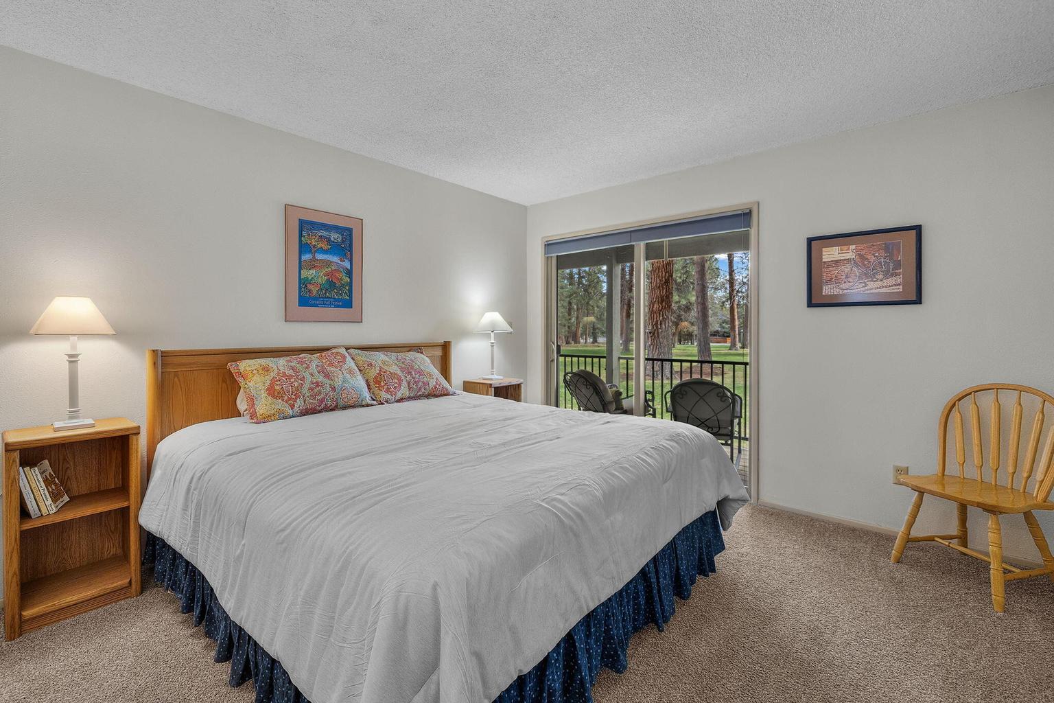 King sized bed, new linens, access to the deck...