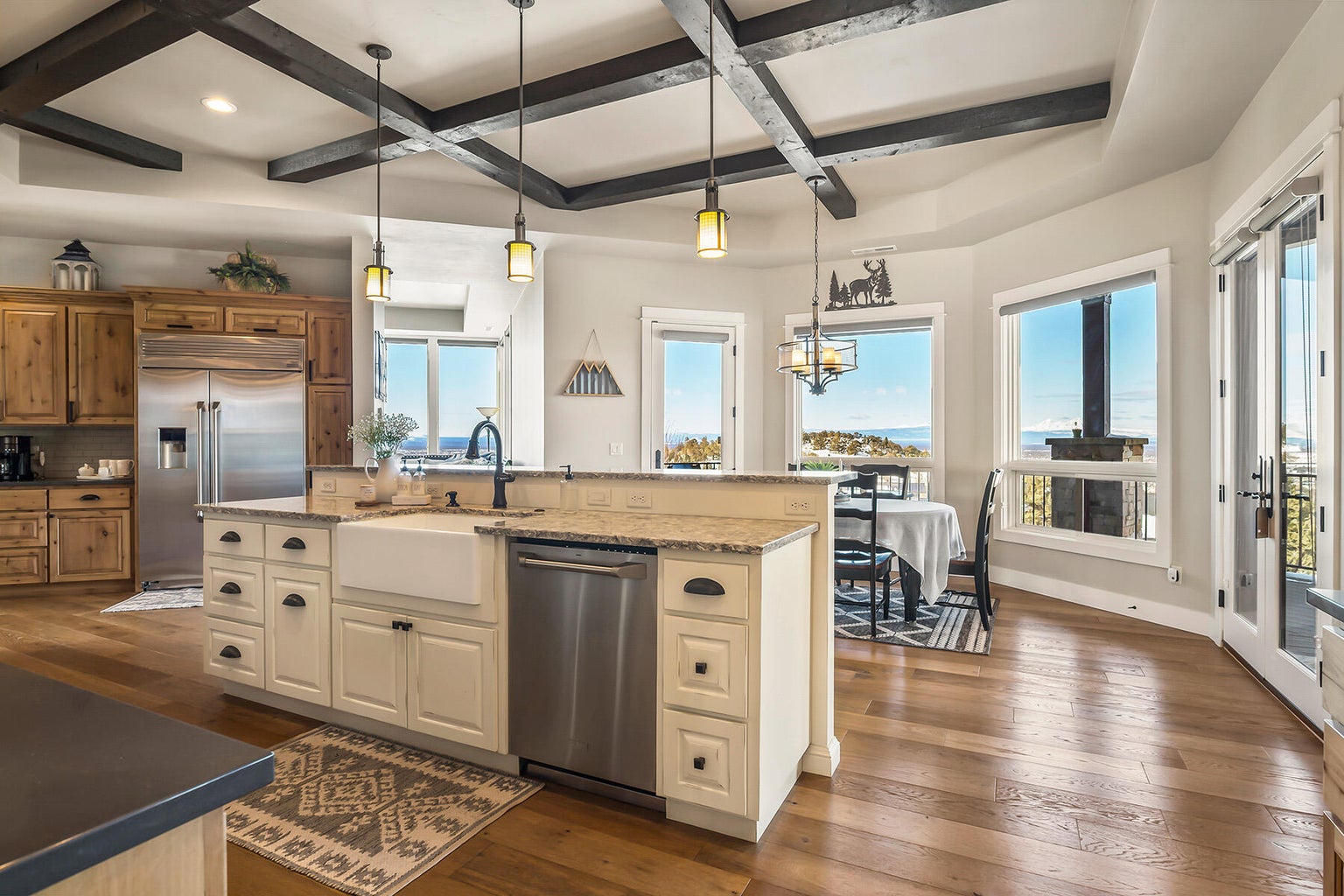 Wood beam ceiling details in kitchen and living room.