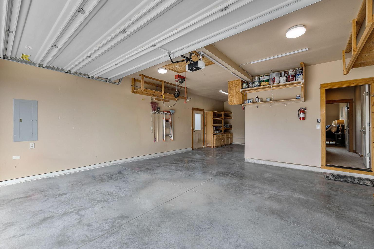 Three-car tandem garage with a workshop and shelves for all your gear