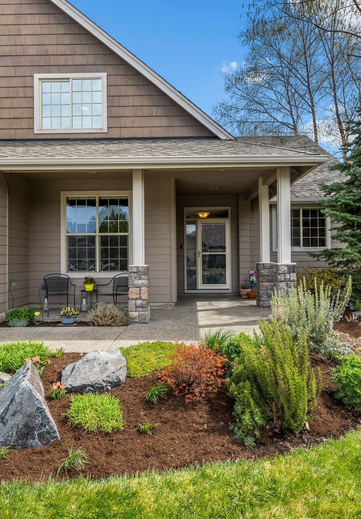 Gorgeous flower beds and accent rocks
