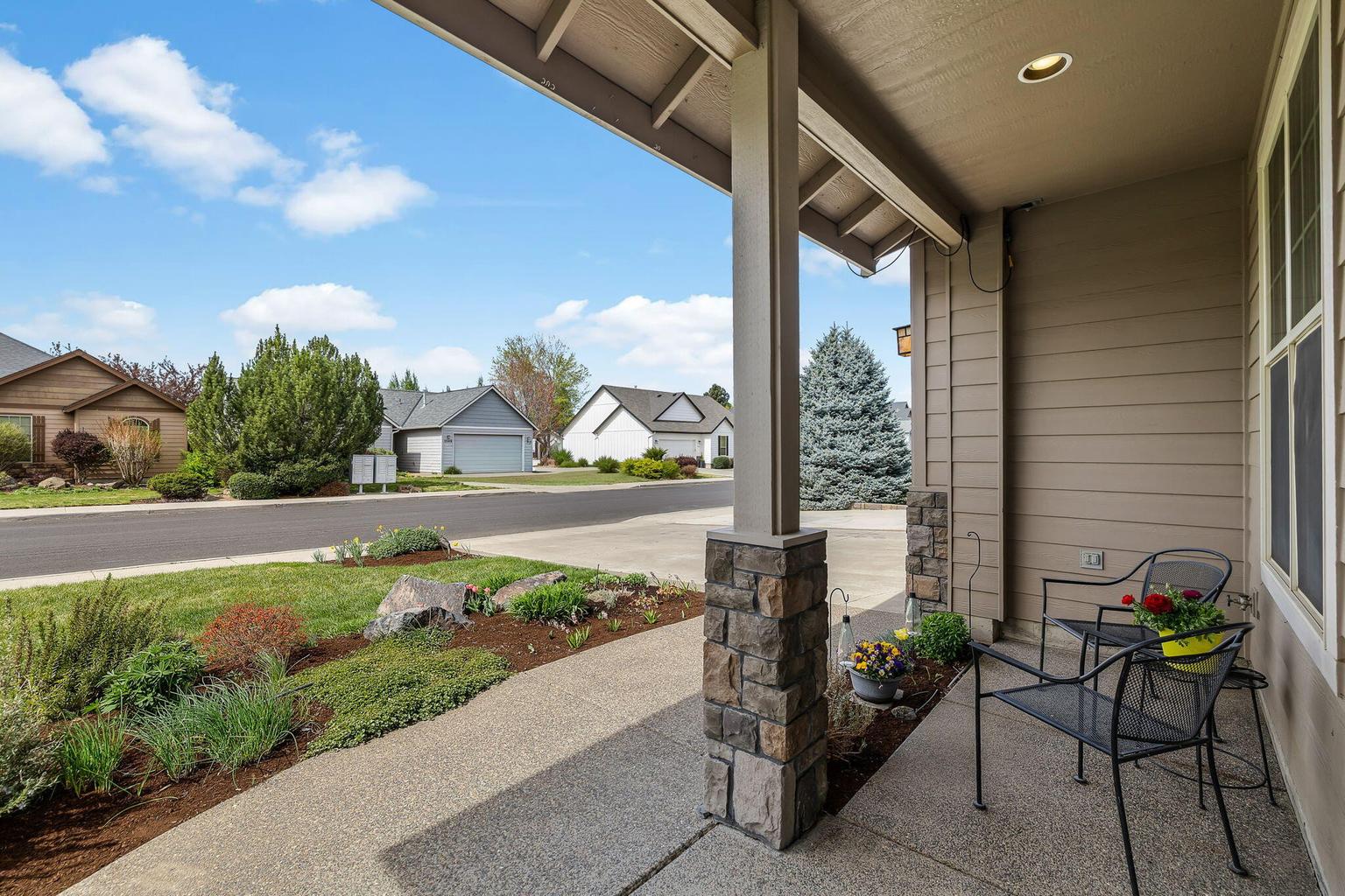 Stone accent columns and aggregate walkway