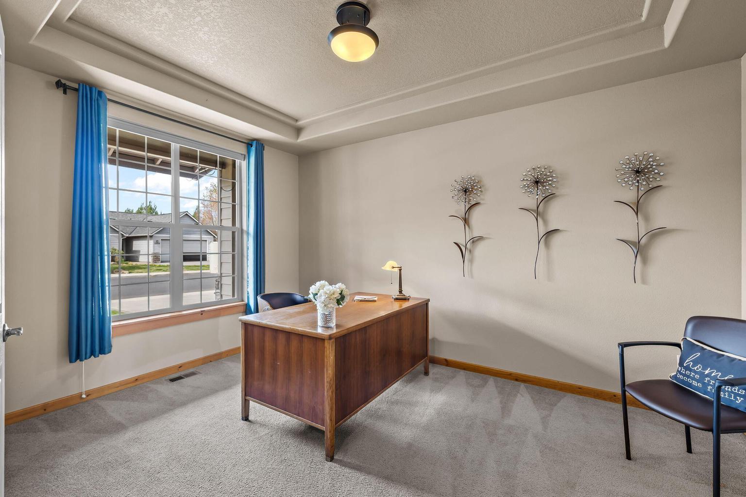 Office is spacious and features a tray ceiling