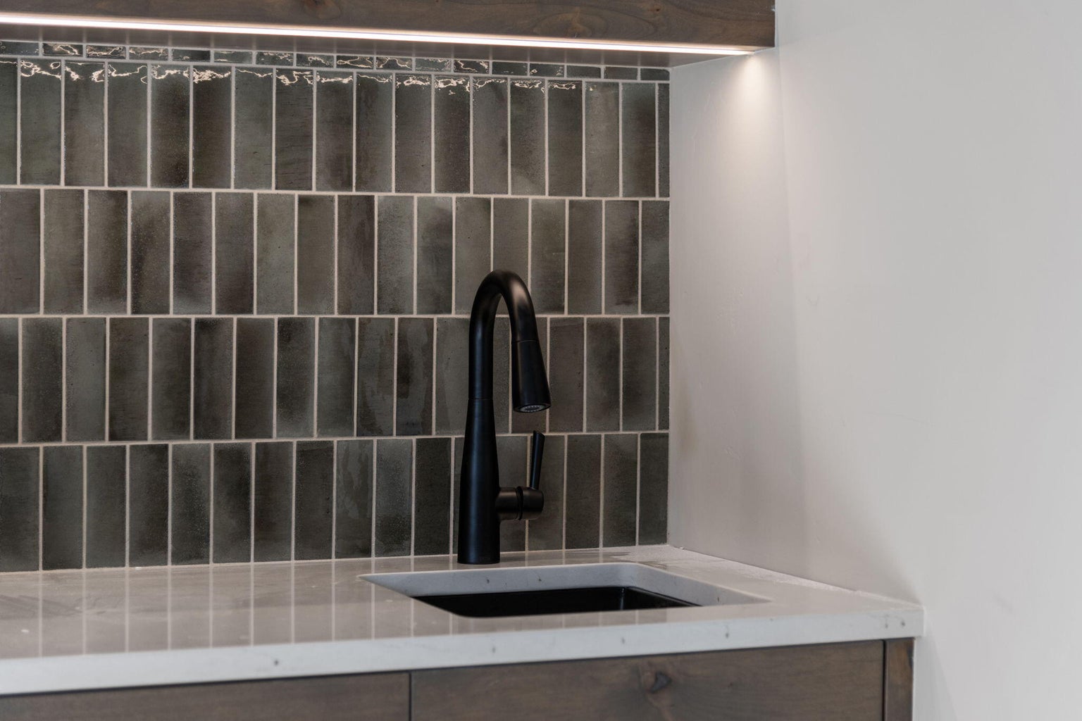 Custom tilework in bonus room wet bar upstairs
