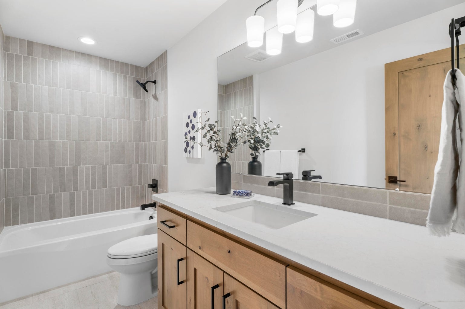 The third bathroom of the home is attached to the bonus room